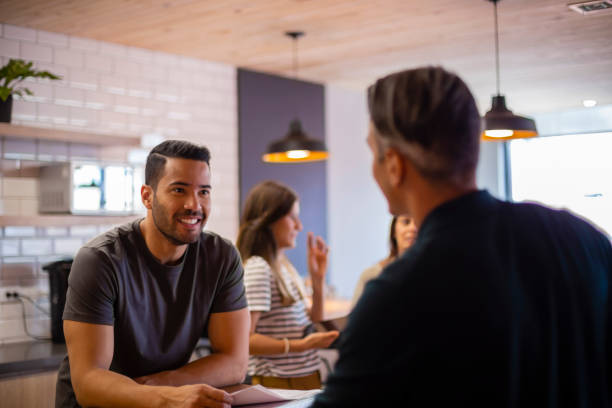 istock Two people discussing something about their work at the office 1191482304