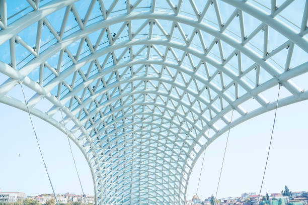 The Bridge of Peace is a bow-shaped pedestrian bridge, a steel and glass construction illuminated with numerous LEDs, over the Kura River in downtown Tbilisi, capital of Georgia.