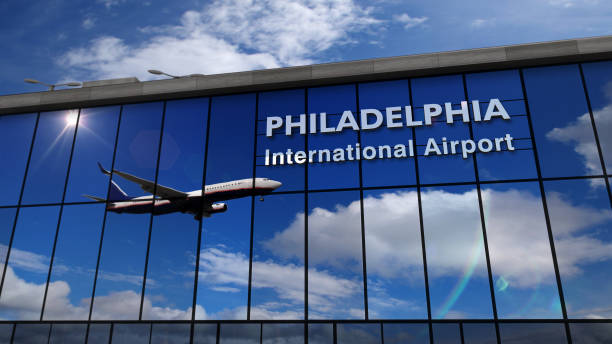 istock Airplane landing at Philadelphia mirrored in terminal 1191482410