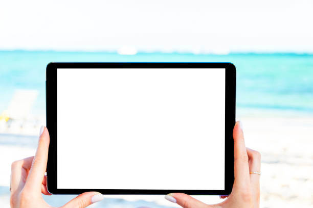 istock Tablet computer mockup in woman hand. New modern black tablet laptop mockup with blank white screen. Empty space for text. Copy space. Isolated white screen 1191484936
