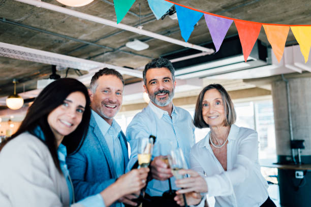 istock Business people celebrating at the office 1191486354