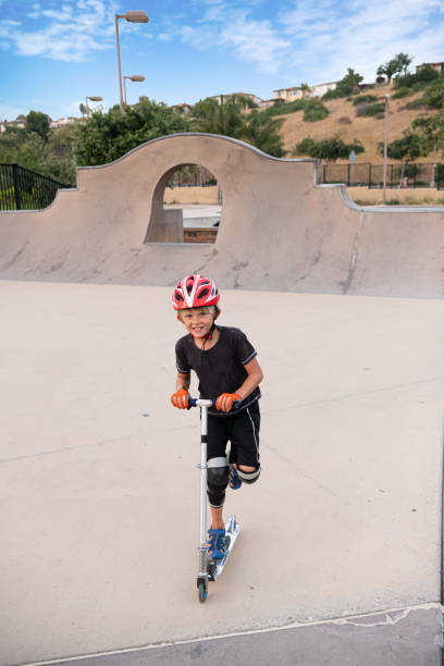 istock A 7 Year Old Boy On A Scooter At The Skate Park 1191487947