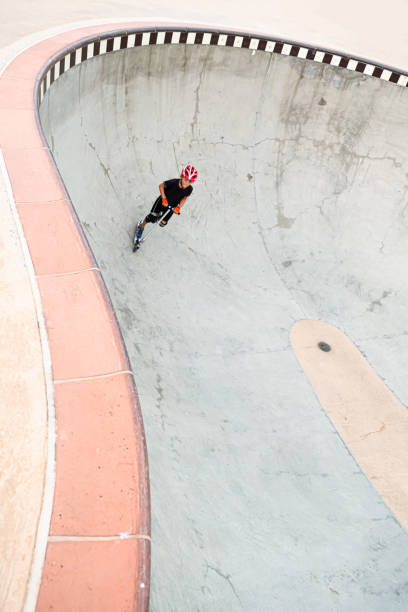 istock A 7 Year Old Boy On A Scooter At The Skate Park 1191488017