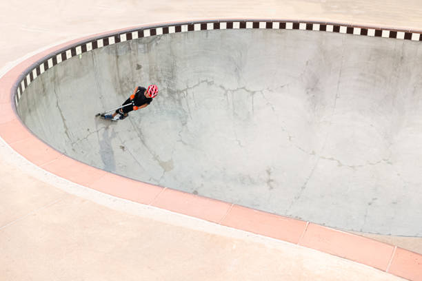 istock A 7 Year Old Boy On A Scooter At The Skate Park 1191488312