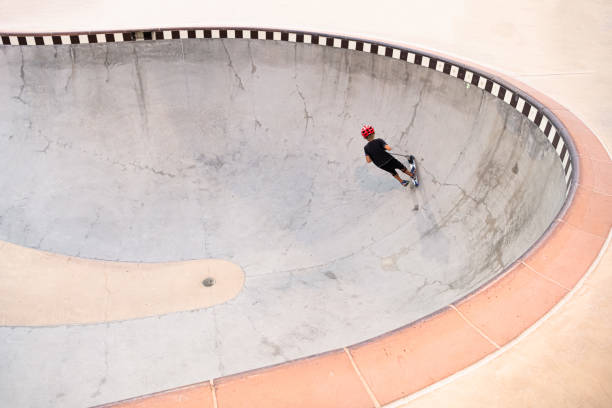 istock A 7 Year Old Boy On A Scooter At The Skate Park 1191488359