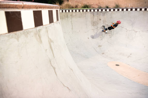 istock A 7 Year Old Boy On A Scooter At The Skate Park 1191488417
