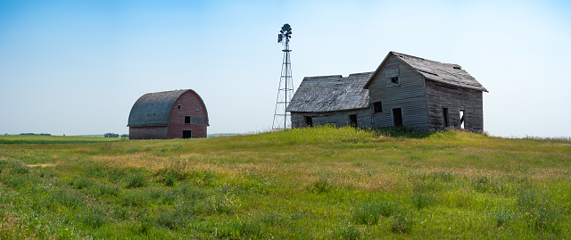 An abandon farm south of Calgary, Alberta in summer. This site has been abandoned for many years but represents the history of Alberta and the legacy of family farming in the area.