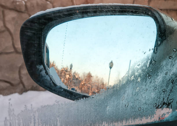 istock Winter cityscape reflected in car sideways in mirror 1191492208