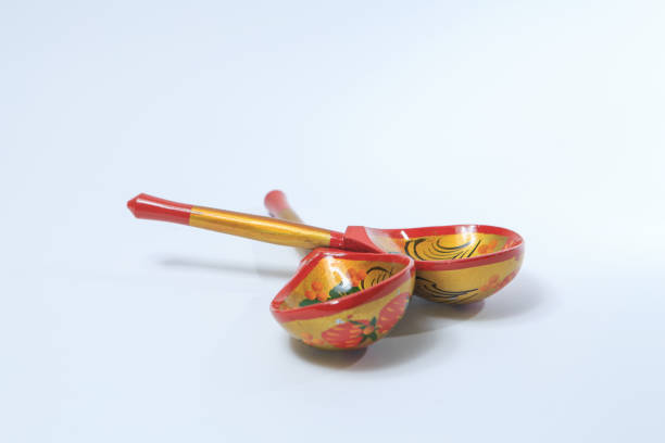 istock Two hand-painted wooden spoons on a white background 1191494298