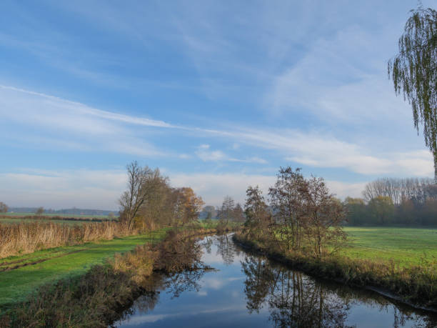 istock autumn at a river in germany 1191495956