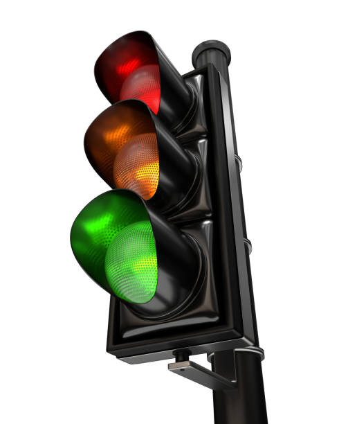 istock Close-up on a traffic light with the three colors on, isolated on white background 1191496177