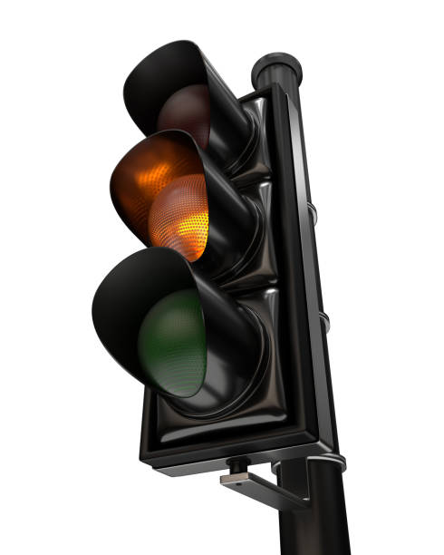 istock Close-up on a traffic light, the orange light is on, isolated on white background 1191496969