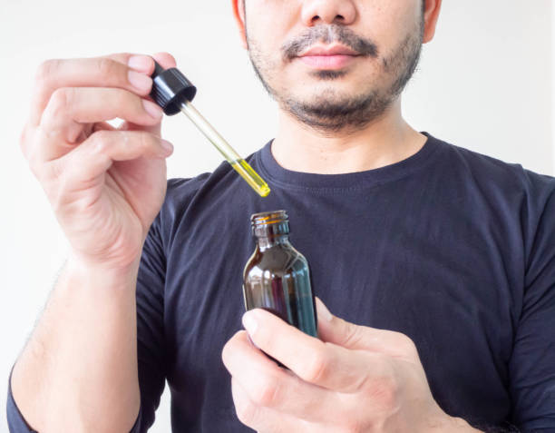 istock A man using Cannabis oil, 
Healthcare concept. 1191497717