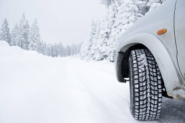 istock Winter Tire on Snow covered road 1191499227