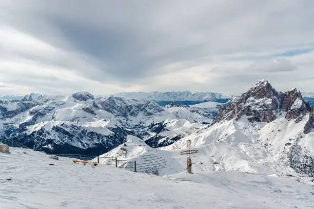 Cloudy view of Dolomite Alps from viewpoint of Passo Pordoi near Canazei of Val di Fassa, Trentino-Alto-Adige region, Italy.