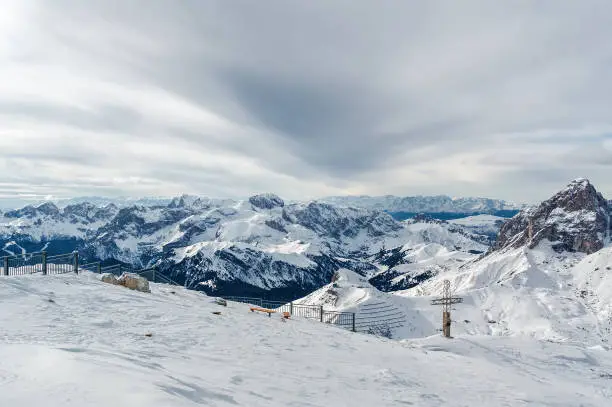 Cloudy view of Dolomite Alps from viewpoint of Passo Pordoi near Canazei of Val di Fassa, Trentino-Alto-Adige region, Italy.