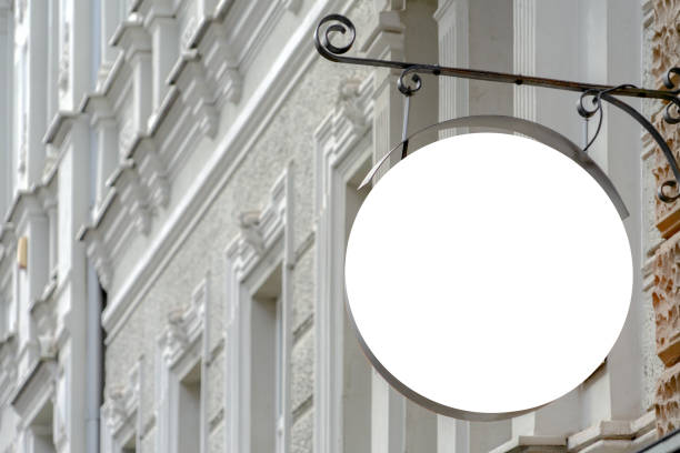istock Mock up. Blank round shape signboard on the wall of classical architecture building 1191499669