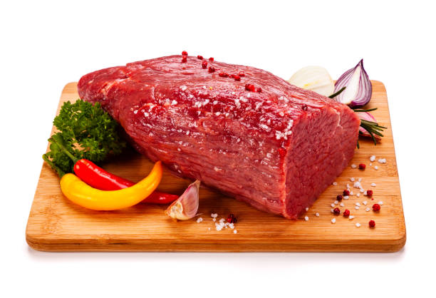 istock Fresh raw beef on cutting board  on white background 1191499940