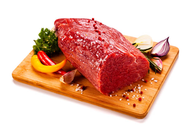istock Fresh raw beef on cutting board  on white background 1191500560