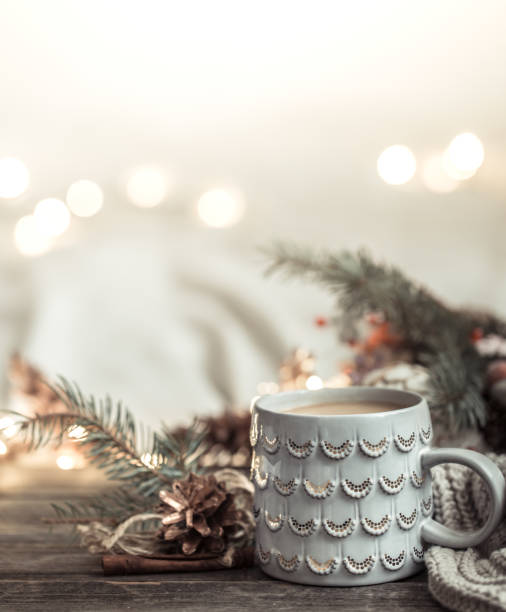 istock Festive background with Cup on wooden background with lights. 1191501379