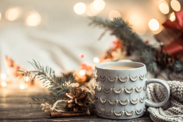 istock Festive background with Cup on wooden background with lights. 1191501484