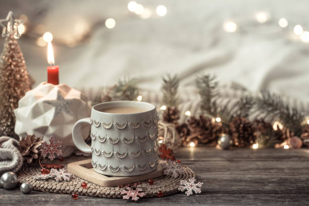 istock Festive background with Cup on wooden background with lights. 1191501487