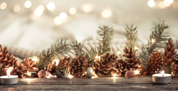 istock Festive New year background with cones and lights. 1191501520