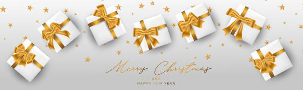 istock Merry Christmas and a Happy New Year banner or header. Simple luxurious elegant design with golden stars, gift box -  presents. Winter holidays concept. Vector illustration. 1191502208