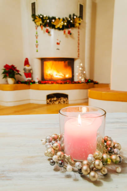 istock Christmas decorations in living room with burning fireplace 1191505740