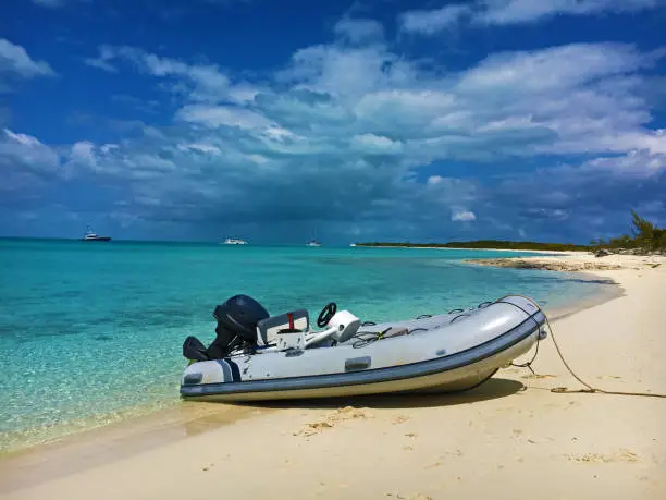 Dinghy pulled up on beach on Norman's Cay Bahamas