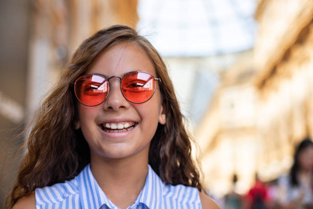 a 10 years old child girl with wavy hair at the outdoor - 10 11 years child human face female imagens e fotografias de stock