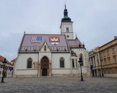 St. Mark's Church, Zagreb, Croatia on a cloudy day. Church with colorful roof.