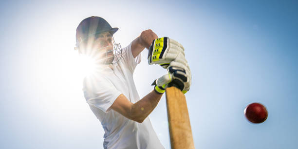 istock Cricket player batting the ball 1191513016