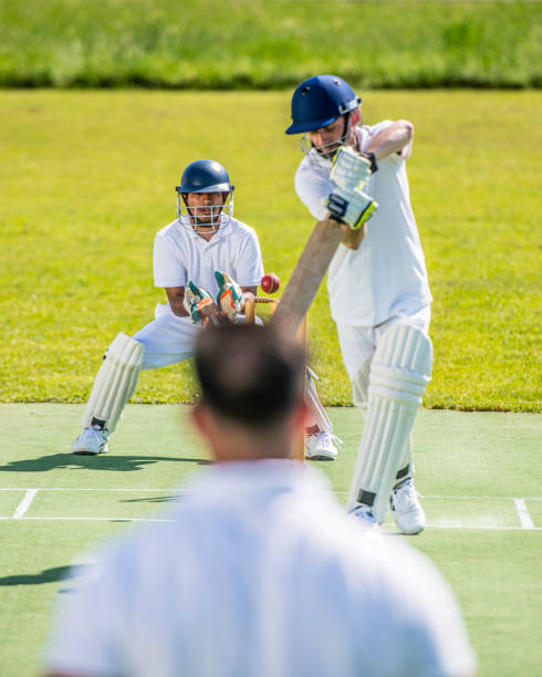 istock Cricket batter hitting the ball 1191513022