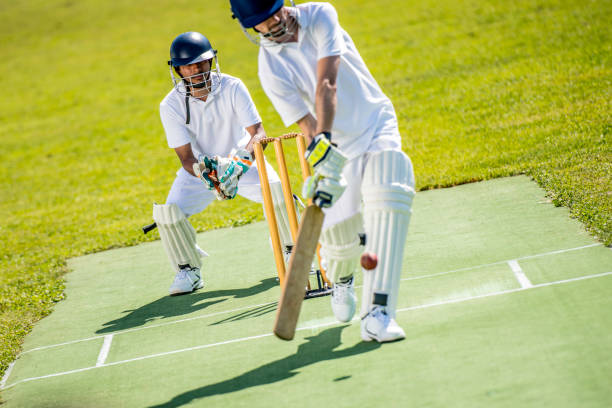 istock Cricket batter hitting the ball 1191513027