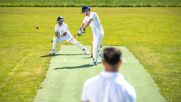 istock Cricket batter hitting the ball 1191513036