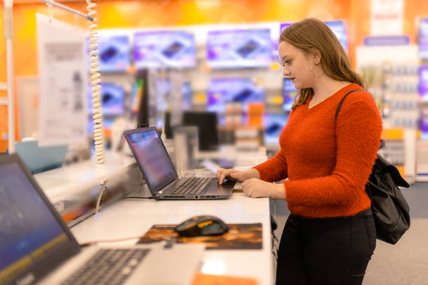 istock Woman chooses the laptop 1191514116
