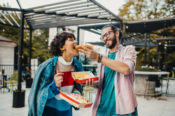 istock Young couple eating fast food 1191514959