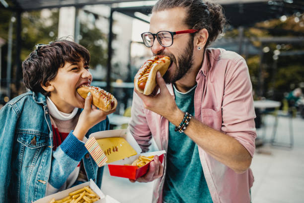 istock Young couple eating fast food 1191515158