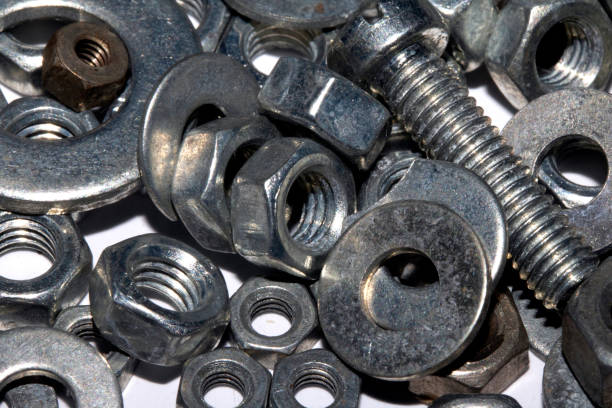 istock Collection of Old Bolt, Screws, Nuts Engineering Metal Tools on White Background 1191516119