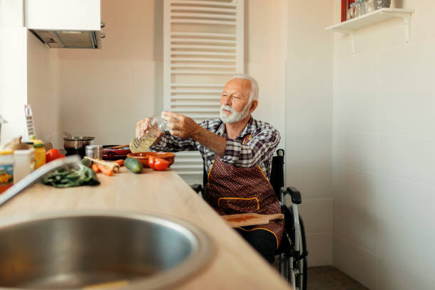 istock Disabled Senior Man Preparing Food 1191516500