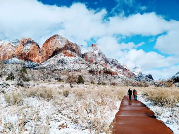 Peaks of Zion National Park as seen from the Pa'rus Trail as clouds clear from heavy snowstorm as seen near the Human History Museum and Springdale Utah