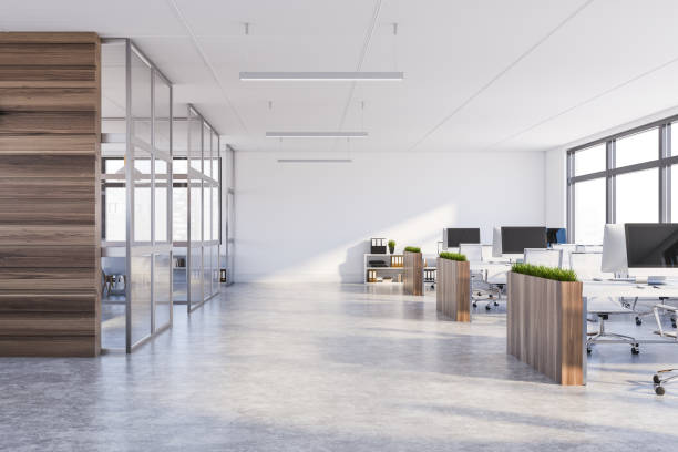 istock White and dark wood open space office interior 1191520965