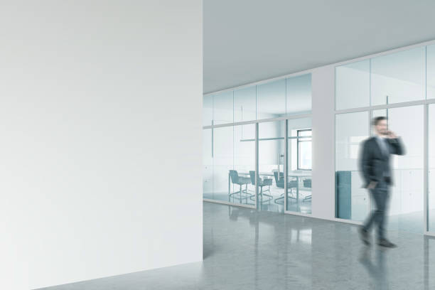 istock Businessman in office with mock up wall 1191520992