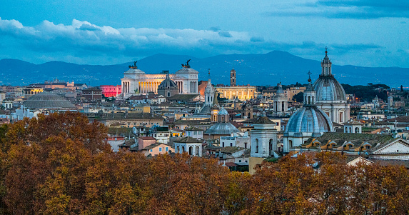 Rome skyline in the evening, as seen from Castel Sant'Angelo, with the dome of Saint Agnese Church, the Campidoglio and the Altare della Patria monument.