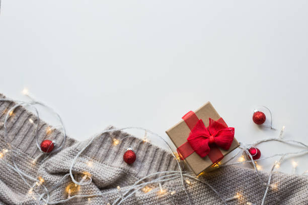 istock Knitted plaid with a garland on a white background 1191524419