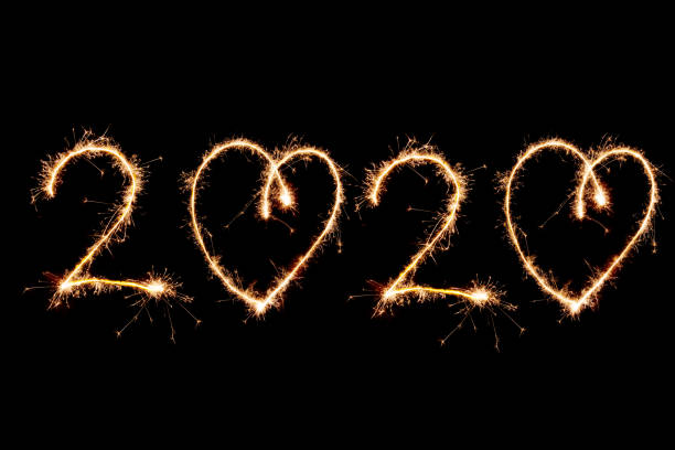 istock 2020 written with Sparkle firework on black background, happy new year 1191527717