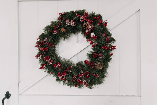 istock Xmas Wreath Decorated Pine Tree Cones and Viburnum 1191535947
