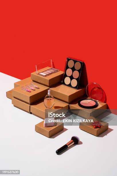 Gift Boxes And Makeup Accessories Organized Neatly On Red And White Background Stock Photo - Download Image Now