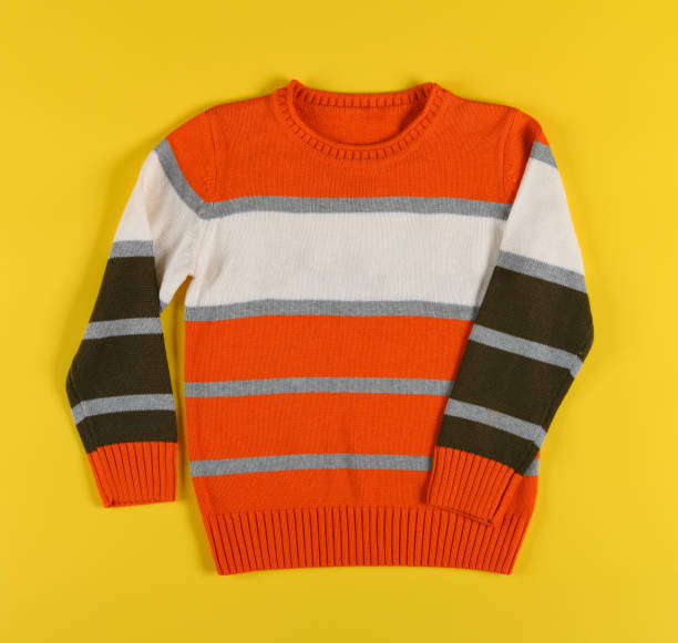 istock colorful sweater for boy on a yellow background 1191539655